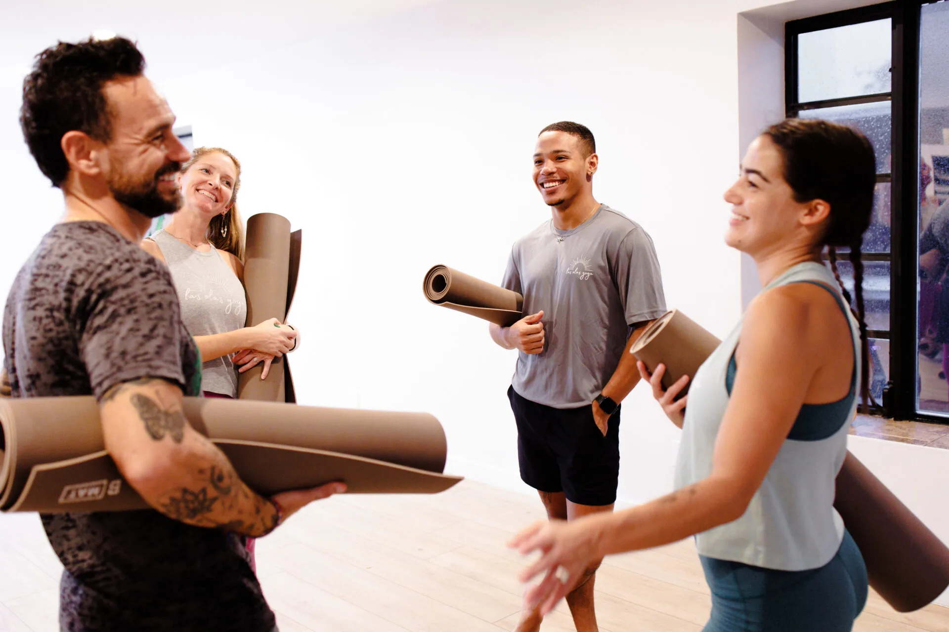 Group of students practicing yoga in a non-heated class at Las Olas Yoga